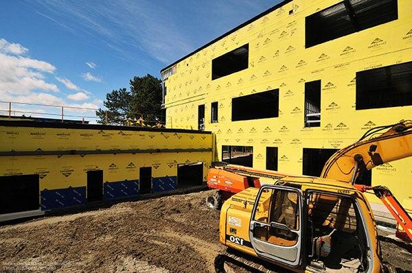 Exterior of a building under construction. it is yellow