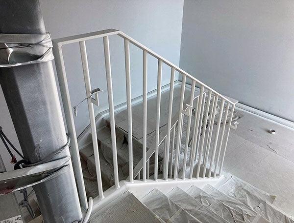a staircase with plastic sheeting on the steps